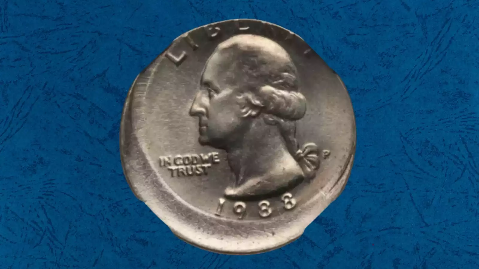 1988 quarter off-center strike error showing design shifted and blank crescent on opposite side